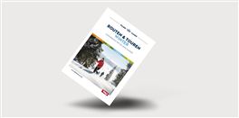 An outstanding cover of a brochure titled "Routes & Tours". It depicts a winter landscape with snow-covered trees and a person walking in the snow.