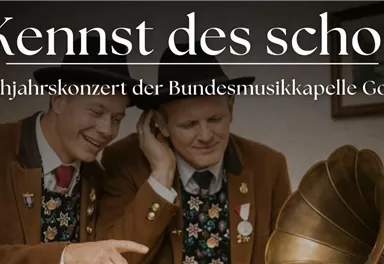 Two men in traditional attire are listening to a gramophone. The image refers to the spring concert of the Federal Music Band Going.