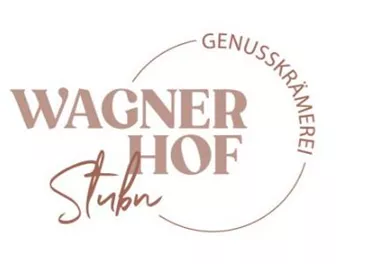 Ein Logo von Wagner Hof Stubn, das die Worte „Genusskrämerei“ und den Namen in ansprechender Schrift zeigt. Es strahlt eine einladende Atmosphäre aus.
