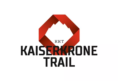Ein modernes Logo für den Kaiserkrone Trail. Es zeigt einen stilisierten Berg in Rot und schwarze Schriftzug.