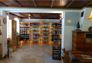 A cozy shop with shelves full of jars and bottles. The warm lights create an inviting atmosphere.