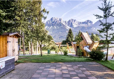 A beautiful playground with a view of the mountains. The surroundings are well-kept and invite you to relax.