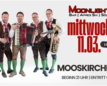 Eine Band in traditioneller Tracht steht zusammen und spielt Musikinstrumente. Das Event findet am Mittwoch, den 11.03., in der Moonlight Bar statt.