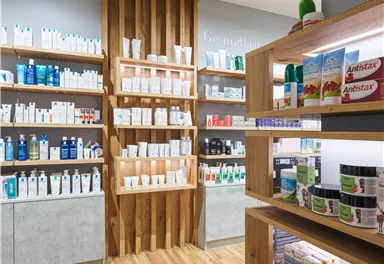 A modern store with shelves full of care products and wellness items. The walls are made of wood, and the products are neatly arranged.