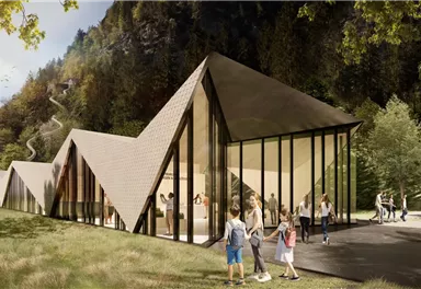 A modern building with a unique architectural shape in a natural environment. Families enjoy spending time outdoors in front of the building.