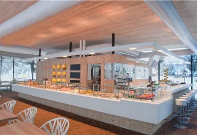 Ein modernes Restaurant mit einem großen Buffetbereich und hellen Holzelementen. Die Tische und Stühle sind stilvoll und laden zum Verweilen ein.