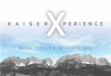 Ein Bild mit dem Titel "KaiserXperience". Es zeigt die Berge in einer schönen Landschaft, wobei der Fokus auf Fahrradtouren und Guiding liegt.