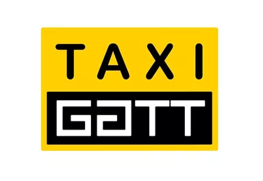 A yellow sign with the inscription "TAXI" and "GATT" in black lettering. It serves as an identifier for a taxi company.