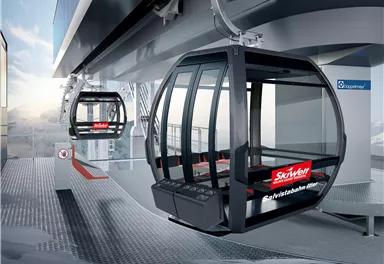 Eine moderne Seilbahnstation mit zwei Gondeln. Die Umgebung zeigt eine alpine Landschaft und ist für den Wintersport geeignet.