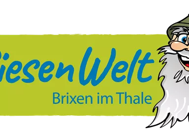 Das Bild zeigt das Logo der RiesenWelt Brixen im Thale. Es enthält einen freundlichen, bärtigen Charakter in einem Hut und den Schriftzug in lebhaften Farben.