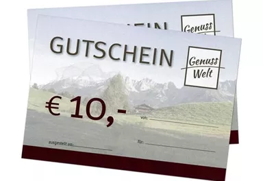 Gutschein über 10 € von GenussWelt. Der Hintergrund zeigt eine Landschaft mit Bergen und Wiesen.