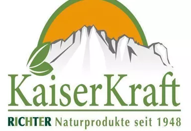 A logo of KaiserKraft that symbolizes the mountains and nature. The lettering highlights the tradition and natural products of the company since 1948.