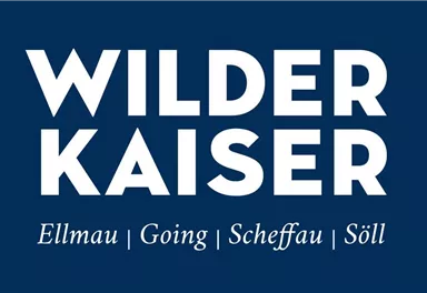 A logo with the inscription "Wilder Kaiser" and the places Ellmau, Going, Scheffau, and Söll. The background is dark blue and the text is white.