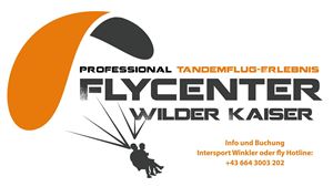 A logo of the Flycenters Wilder Kaiser, offering tandem flight experiences. The graphic shows a paraglider and includes contact details for bookings.