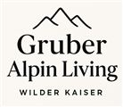 An elegant logo featuring the inscription "Gruber Alpin Living" and a stylized mountain silhouette. The name points to alpine living options in the Wilder Kaiser region.