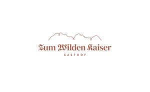 A simple logo featuring the inscription "Zum Wilden Kaiser" and the label "Gasthof". In the background, stylized mountain outlines are visible.