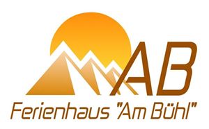 A logo with a sunrise over stylized mountains. Below it is the text "Vacation Home 'Am Bühl'."