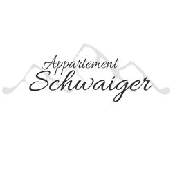 The image shows the inscription "Appartement Schwaiger" in an elegant font. In the background, stylized mountains are hinted at.