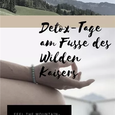 A hand in a meditation position with a picturesque mountain landscape in the background. The surroundings convey tranquility and relaxation, perfect for detox days.