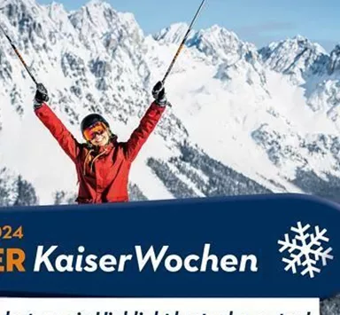 A skier cheers on a snow-covered mountain with majestic peaks in the background. The image promotes the Ellmauer KaiserWeeks from January 6 to January 27, 2024.