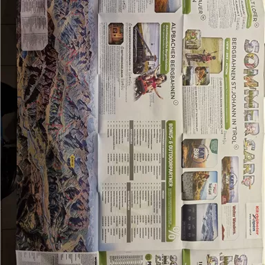 An information card about summer activities in the mountains of Tyrol. The card shows various leisure options and attractions in the region.