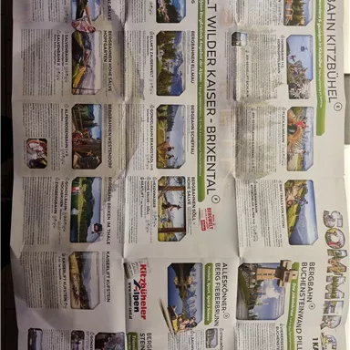 A folded brochure about activities in the Kitzbühel and Brixental region. It showcases various leisure options and attractions for the summer.
