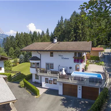 A charming house in a picturesque mountain landscape. The garden is well-maintained and a pool adds to the relaxed atmosphere.