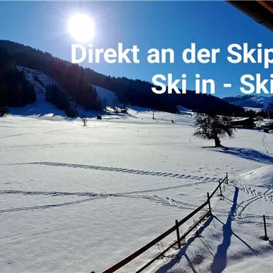 A snowy landscape with a sunny ski slope in the background. Perfect for skiers who want to jump straight into the adventure.