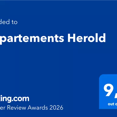 The image shows an award from Booking.com for the Herold Apartments with a rating of 9.3 out of 10. It is the Traveller Review Awards 2026.
