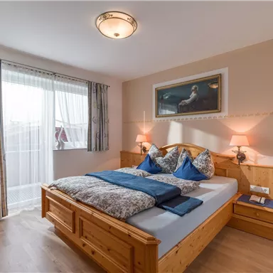 Solid wooden bed made of spruce in comfort height 180x200cm with open footboard