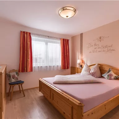 A solid wood bed made of spruce 180x200cm with an open footboard