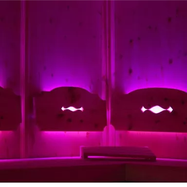 Three wooden panels with bright pink lights. The gentle lighting creates a cozy atmosphere.