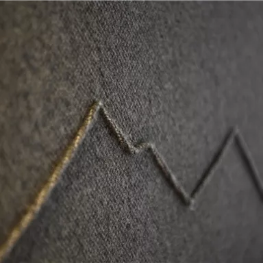 A gray fabric with a uniform, ascending line graphic. The lines resemble a diagram or a statistical representation.