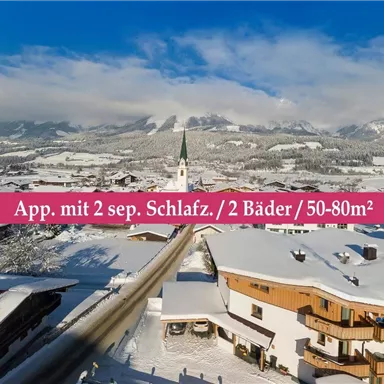 A picturesque winter landscape with snow-covered mountains and a quiet village. The image description shows an apartment with two bedrooms and two bathrooms.
