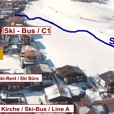 A map overview of a ski area with ski slopes and bus stops for the ski bus. Important points are highlighted on the map with red markings.