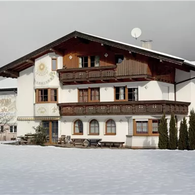 A traditional alpine house in the snow.
Surrounded by a tranquil winter landscape.