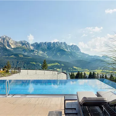 A stunning infinity pool overlooking majestic mountains. The scenery offers a perfect combination of nature and relaxation.