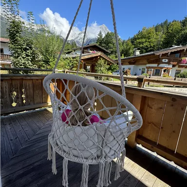 Time out in the nest swing with a view of the Wilder Kaiser