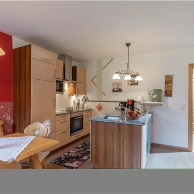 Well-equipped kitchen with filter coffee machine, kettle, SodaStream for sparkling spring water, egg cooker, dishwasher, oven, freezer, and refrigerator.