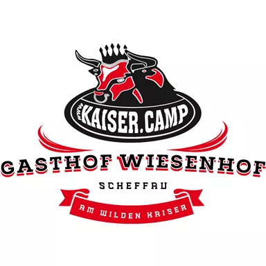 A logo of the Wiesenhof inn featuring a stylized bull. The lettering emphasizes the location at the Wilder Kaiser.
