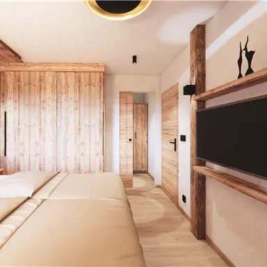 Ein modernes Zimmer mit Holzverkleidung und hellen Farben. Das Zimmer ist gemütlich eingerichtet und verfügt über ein Doppelbett und einen Fernseher.