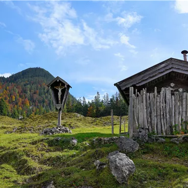 An idyllic landscape with a traditional cottage